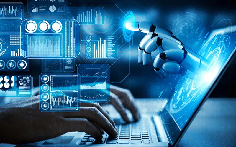 Hacker’s robotic hand reaching from laptop toward typing hands, with cybersecurity expert blocking attack digitally.