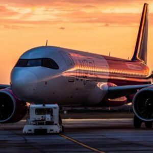 Brussels Airlines aircraft on runway during sunset